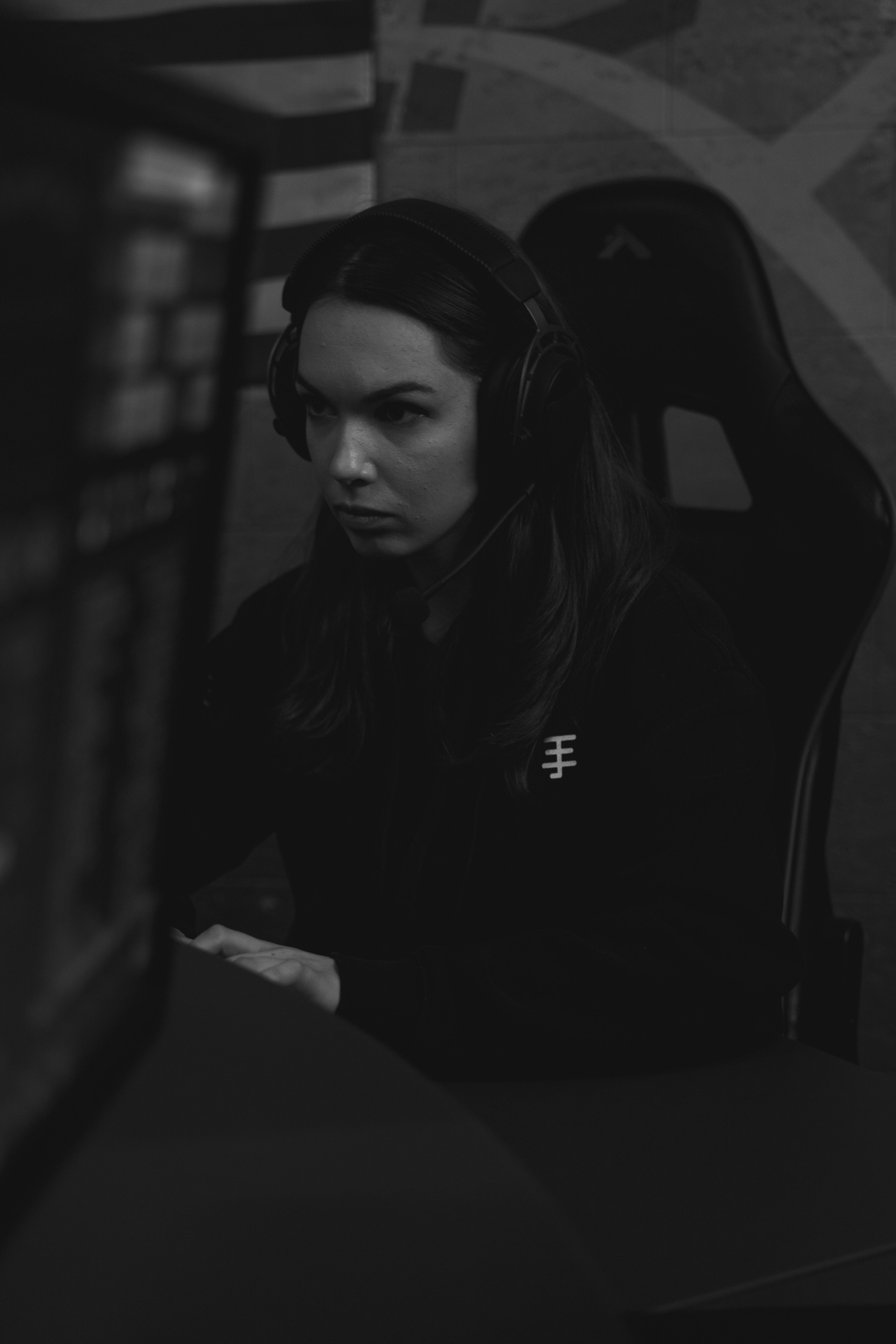 Portrait of Wraith, in-game leader of Vanta Five, focused at his station