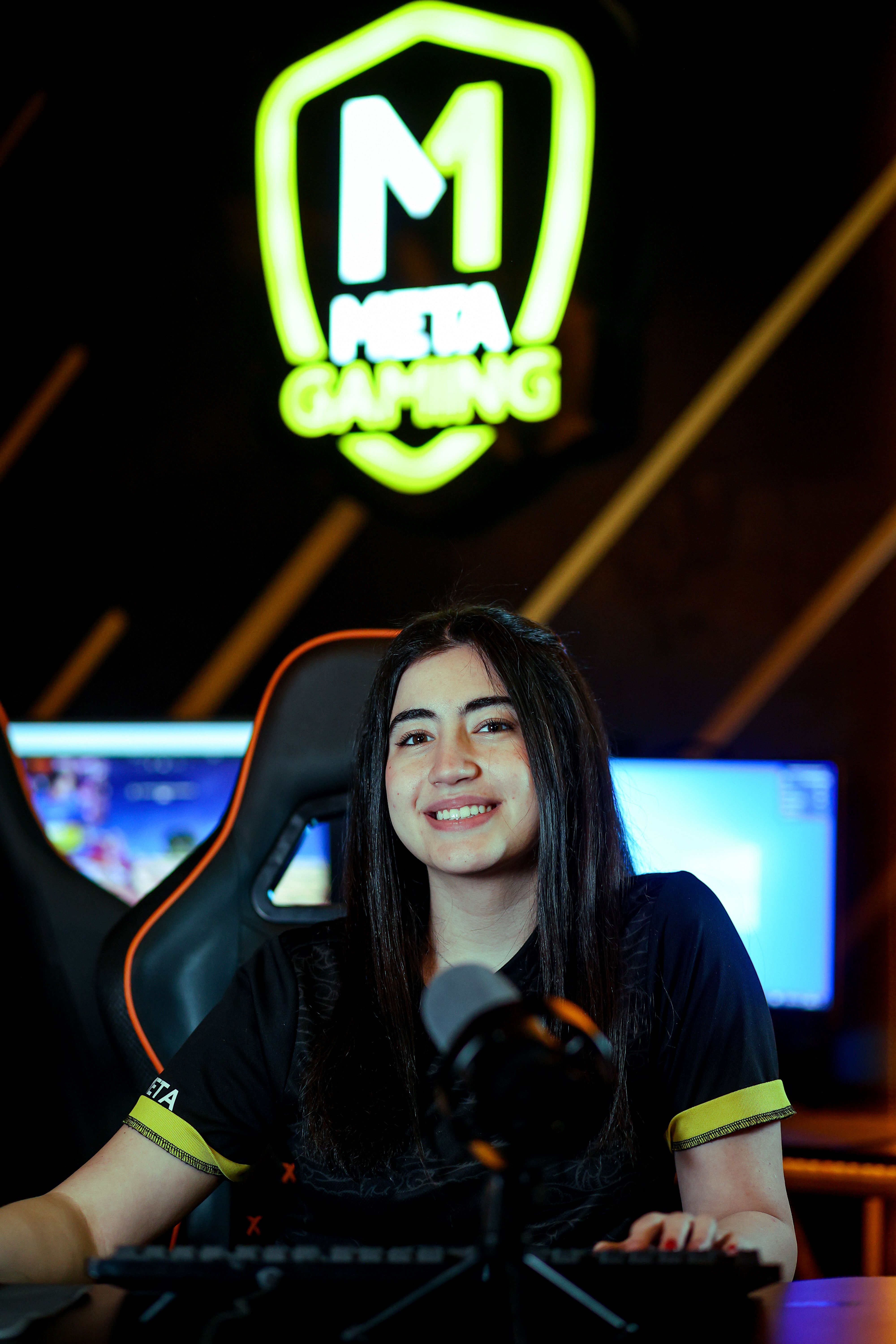 Portrait of Novella, flex player of Vanta Five, headset on and ready